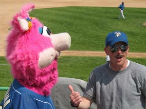 Coach and Madonna at the Saints Paul Saints exhibition game